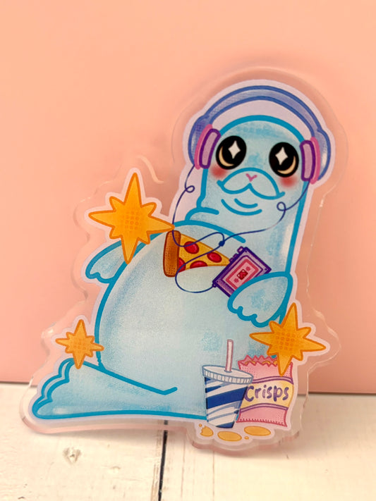 Large Snack Seal Pin - finished version featuring a blue seal with headphones, pizza and crisps