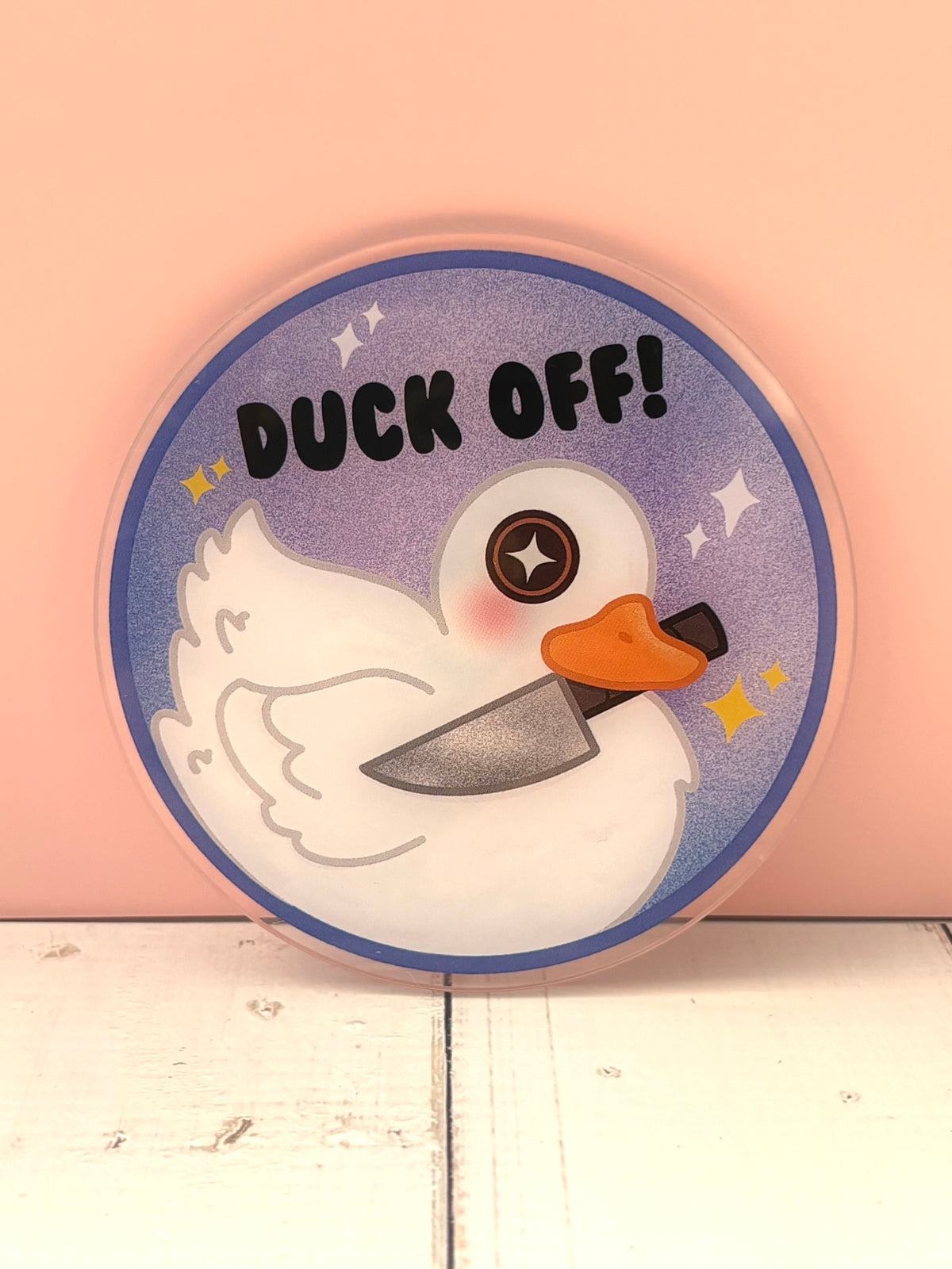 Large Duck Off! Pin - finished version featuring a white duck holding a cleaver on a sparkly purple background