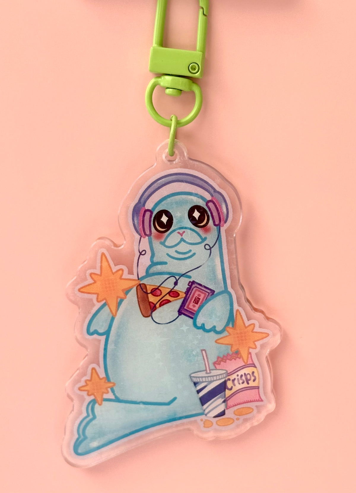 Snack Seal Holographic Keyring - blue seal with headphones holding pizza, a drink and crisps on a holographic acrylic charm