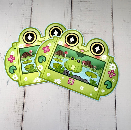 Gaming Frog Console Sticker - two stickers showing a frog-shaped gaming console with a pond scene
